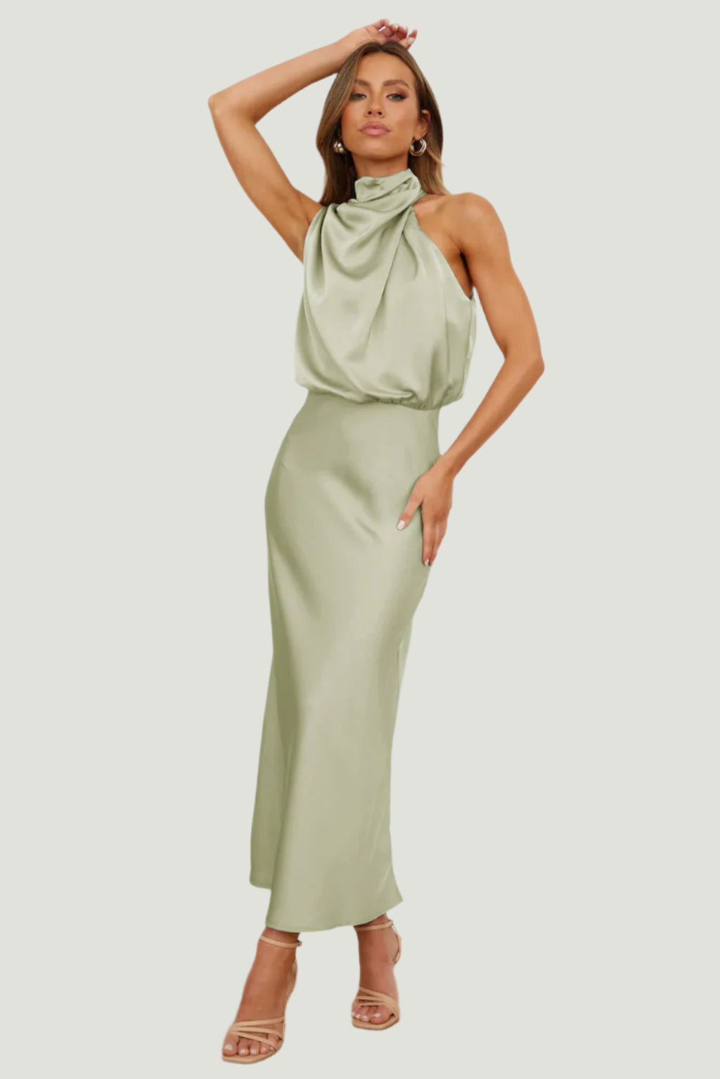 Elegant Carola - Halter Neck Satin Dress showcases sophisticated design and subtle shine, perfect for any occasion.