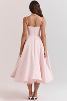 Elegant back view of the Benita - Elegant Dress, showcasing its stunning satin fabric and flared skirt. Perfect for events.