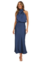 Elegant Carola - Halter Neck Satin Dress, showcasing a modern silhouette and subtle shine for stylish occasions.