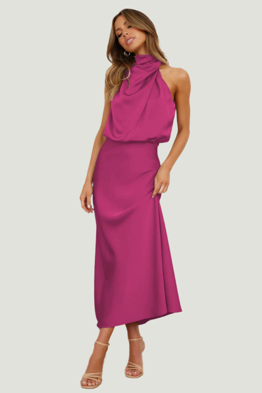 Elegant Carola - Halter Neck Satin Dress in vibrant pink, showcasing a modern silhouette and fluid design.