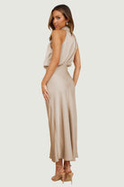 Elegant Carola - Halter Neck Satin Dress showcasing a sleek design and subtle shine, perfect for special occasions.