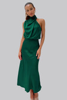 Elegant Carola - Halter Neck Satin Dress in green, showcasing a sophisticated design and fluid silhouette. Perfect for any occasion.