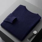 Evan Elegant Merino Wool Sweater displayed elegantly beside a classic watch, showcasing superior comfort and style.