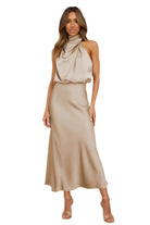 Elegant Carola - Halter Neck Satin Dress featuring a modern silhouette and subtle shine, perfect for any occasion.